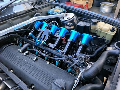 An E30 with a Set of Trumpets ITBs